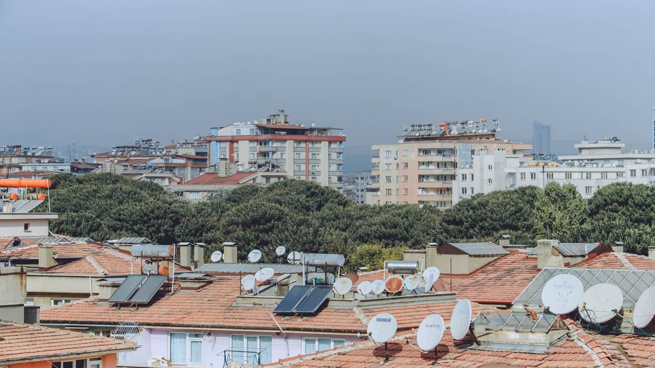 Solar panels integrated with Starlink dish power system on Nigerian rooftop